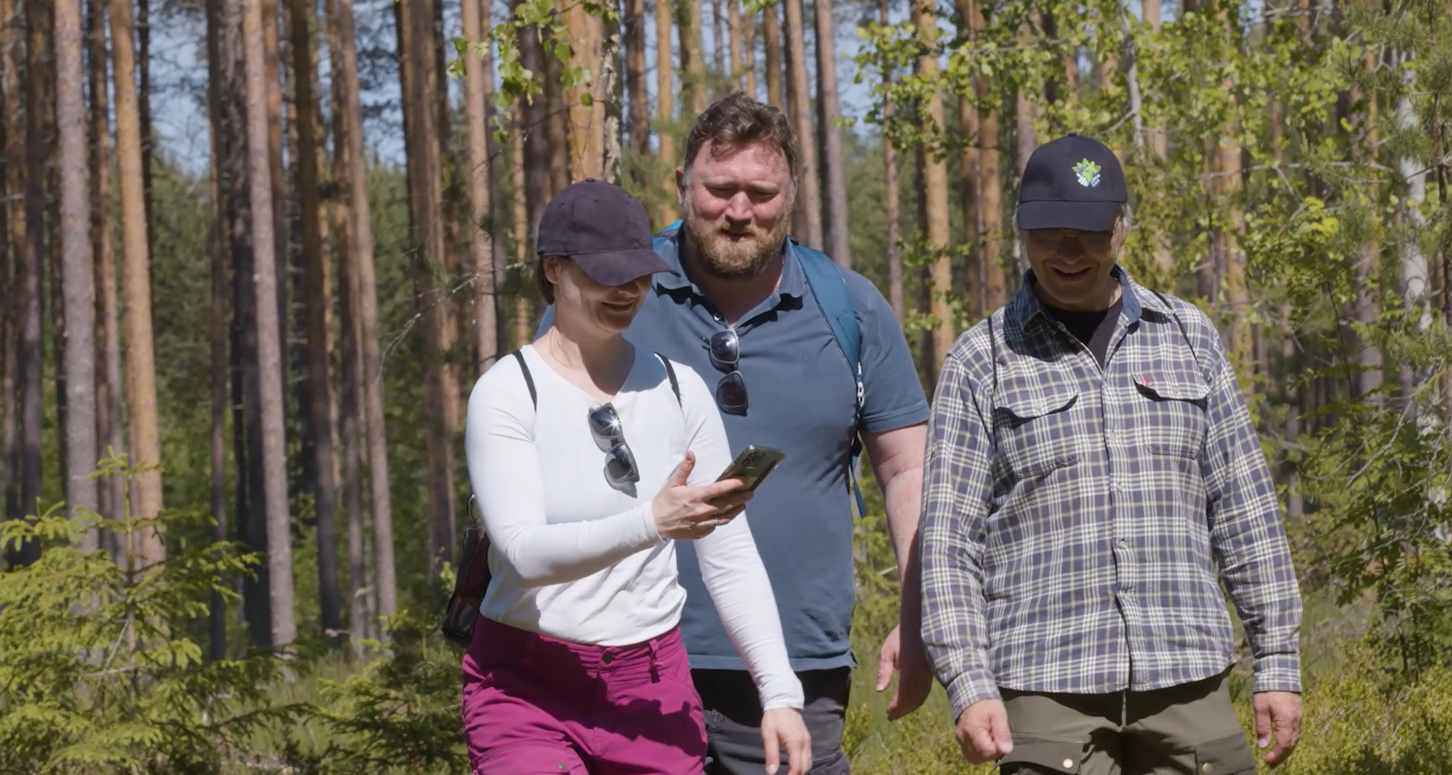Three researchers in the forest.
